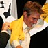 Andy Schleck puts on the yellow jersey